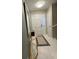 Bright foyer featuring stylish tiling, a decorative mirror, and a classic front door at 5 Belmonte Sw Ct, Atlanta, GA 30311