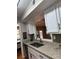 Well-lit kitchen featuring granite countertops, stainless steel appliances, and white cabinets at 5 Belmonte Sw Ct, Atlanta, GA 30311