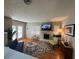 Comfortable living room with a brick fireplace and large windows offering ample natural light at 5 Belmonte Sw Ct, Atlanta, GA 30311
