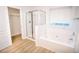 Bathroom with soaking tub, shower, and walk-in closet at 4126 Mcbride Dr, Powder Springs, GA 30127