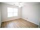 Bright bedroom with ceiling fan and window at 4126 Mcbride Dr, Powder Springs, GA 30127