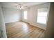Spacious bedroom with ceiling fan and two windows at 4126 Mcbride Dr, Powder Springs, GA 30127
