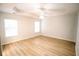 Spacious bedroom with hardwood floors and multiple windows at 4126 Mcbride Dr, Powder Springs, GA 30127