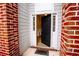 Inviting front entrance with brick columns and a black door at 4126 Mcbride Dr, Powder Springs, GA 30127