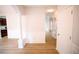 Light-filled hallway with wood flooring and white trim at 4126 Mcbride Dr, Powder Springs, GA 30127