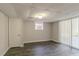 Finished basement area with sliding glass doors and flooring at 8652 Embrey Dr, Jonesboro, GA 30236