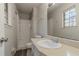 Updated bathroom with a shower/tub combo and new vanity at 8652 Embrey Dr, Jonesboro, GA 30236