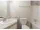 Clean bathroom with a bathtub, shower, and updated vanity at 8652 Embrey Dr, Jonesboro, GA 30236