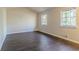 Spacious bedroom with hardwood floors and multiple windows at 8652 Embrey Dr, Jonesboro, GA 30236
