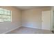 Simple bedroom with carpet, neutral walls, and one window at 8652 Embrey Dr, Jonesboro, GA 30236