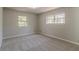 Bright bedroom featuring neutral walls and plush carpeting at 8652 Embrey Dr, Jonesboro, GA 30236