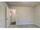 Bedroom with carpet, neutral walls, and built-in closet at 8652 Embrey Dr, Jonesboro, GA 30236