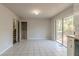 Dining area with tile floors and access to deck at 8652 Embrey Dr, Jonesboro, GA 30236