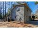 Gray house exterior with wooden deck and stairs at 8652 Embrey Dr, Jonesboro, GA 30236