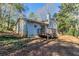 Gray house exterior with wooden deck and stairs at 8652 Embrey Dr, Jonesboro, GA 30236
