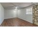 Spacious living room with wood-look flooring and ceiling fan at 8652 Embrey Dr, Jonesboro, GA 30236