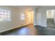 Living room with hardwood floors and access to staircase at 8652 Embrey Dr, Jonesboro, GA 30236