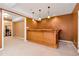 Finished basement bar with wood cabinetry and a carpeted floor at 1426 Greenridge Trl, Lithonia, GA 30058