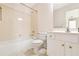 Clean bathroom with a white vanity, bathtub, and toilet at 1426 Greenridge Trl, Lithonia, GA 30058