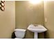 Powder room with pedestal sink and toilet at 1426 Greenridge Trl, Lithonia, GA 30058