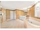 Primary bathroom with soaking tub, shower, and updated fixtures at 1426 Greenridge Trl, Lithonia, GA 30058