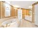 Bathroom with large soaking tub and access to bedroom at 1426 Greenridge Trl, Lithonia, GA 30058
