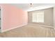 Bright bedroom with neutral walls and plush carpeting at 1426 Greenridge Trl, Lithonia, GA 30058