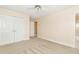 Spacious bedroom with double doors and carpet at 1426 Greenridge Trl, Lithonia, GA 30058