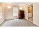 Spacious bedroom with neutral carpeting and an ensuite bathroom at 1426 Greenridge Trl, Lithonia, GA 30058
