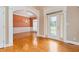 Spacious entryway showcasing hardwood floors and an arched opening to the dining room at 1426 Greenridge Trl, Lithonia, GA 30058
