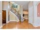Hardwood floor entryway, view of staircase and kitchen at 1426 Greenridge Trl, Lithonia, GA 30058