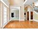 Two-story entryway with hardwood floors, open staircase, and views to other rooms at 1426 Greenridge Trl, Lithonia, GA 30058