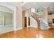 Grand two-story entryway with hardwood floors and an open staircase at 1426 Greenridge Trl, Lithonia, GA 30058