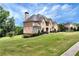 Two story home with a side view of the house and yard at 1426 Greenridge Trl, Lithonia, GA 30058