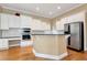 Kitchen boasts white cabinets, granite countertops, and stainless steel appliances at 1426 Greenridge Trl, Lithonia, GA 30058