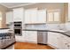 Spacious kitchen with stainless steel appliances and granite countertops at 1426 Greenridge Trl, Lithonia, GA 30058