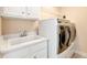 Laundry room with washer, dryer, and utility sink at 1426 Greenridge Trl, Lithonia, GA 30058