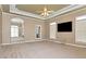 Large living room with high ceilings, carpet, and fireplace at 1426 Greenridge Trl, Lithonia, GA 30058