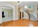 Open living room with hardwood floors and view of office at 1426 Greenridge Trl, Lithonia, GA 30058