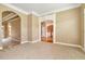 Spacious living area with neutral carpeting and archways at 1426 Greenridge Trl, Lithonia, GA 30058