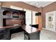Home office with L-shaped desk and built-in hutch at 1426 Greenridge Trl, Lithonia, GA 30058
