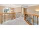 Spacious upstairs hallway with window and high ceiling at 1426 Greenridge Trl, Lithonia, GA 30058