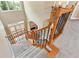 Upstairs hallway with wood railing and carpeted floor at 1426 Greenridge Trl, Lithonia, GA 30058