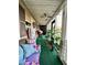Spacious screened-in porch with seating and potted plants at 985 Farrington Se Pl, Atlanta, GA 30315
