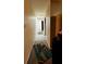 Long hallway with neutral walls and carpeting, leading to other rooms at 985 Farrington Se Pl, Atlanta, GA 30315