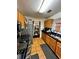 Functional kitchen with stainless steel appliances and wood cabinets at 985 Farrington Se Pl, Atlanta, GA 30315