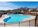 Community swimming pool with a kidney shape and black fence at 1076 Allspice Way, Lawrenceville, GA 30045