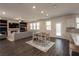 Bright dining area with hardwood floors and view into living room at 1076 Allspice Way, Lawrenceville, GA 30045
