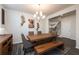 Dining room features a rustic wooden table and chandelier at 1076 Allspice Way, Lawrenceville, GA 30045