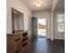 Bright entryway with dark hardwood floors and rustic console table at 1076 Allspice Way, Lawrenceville, GA 30045